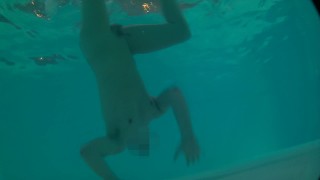Twink loses trunks in hotel pool and swims naked